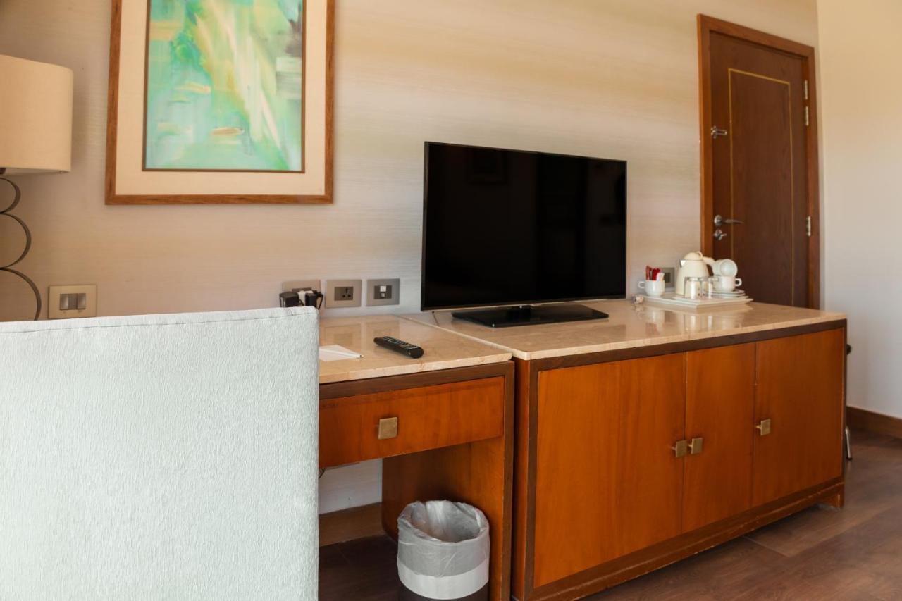 Sharm Dreams Vacation Club - Aqua Park Hotel Kültér fotó A television in a hotel room